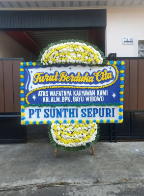 Papan Bunga Duka di Pal Merah